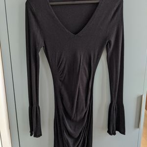 Stretchy little black dress with bell sleeves